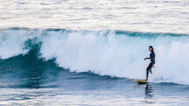 Surfer Turning Mid Wave