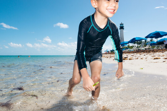 Boy having fun beach summer vacation