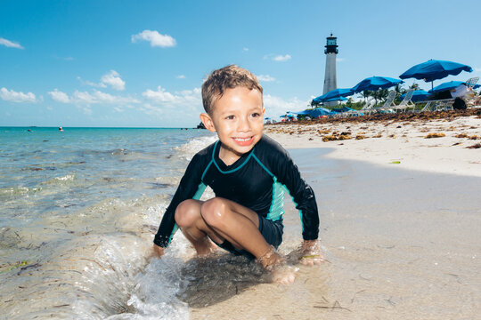 Boy having fun beach summer vacation