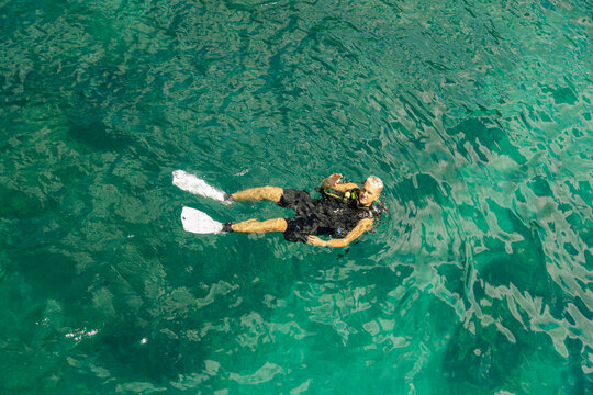 Scuba Instructor Floating in the Sea in Koh Tao