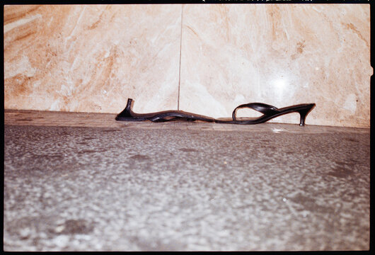 Discarded High Heel Shoes on street after Pride Party