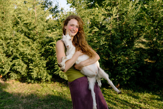 Woman holding goat