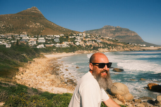 Bearded man enjoying coastal mountain view in Cape Town

