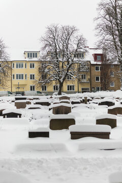 Traditional Swedish Cemetery and City Building in Winter