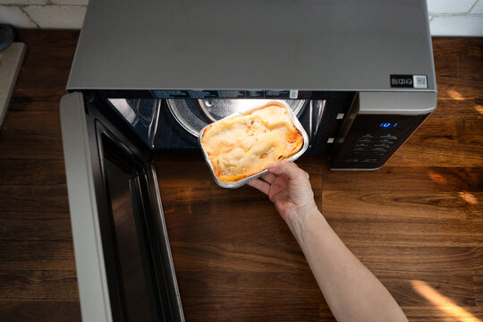Preparing frozen ready meal lasagna in a microwave