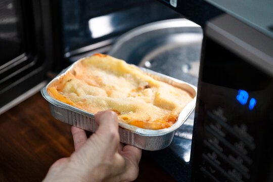 Preparing frozen ready meal lasagna in a microwave