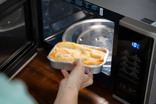 Preparing frozen ready meal lasagna in a microwave