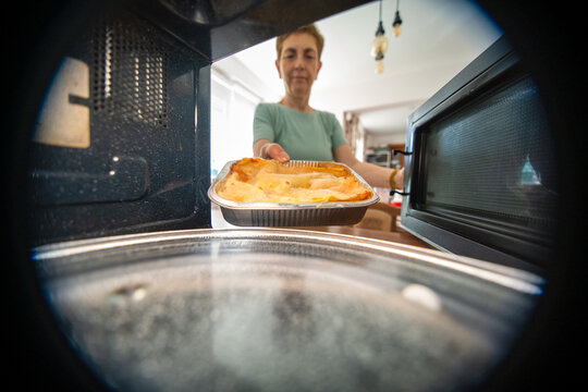 Preparing frozen ready meal lasagna in a microwave