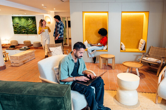People collaborating and working in modern co-working space
