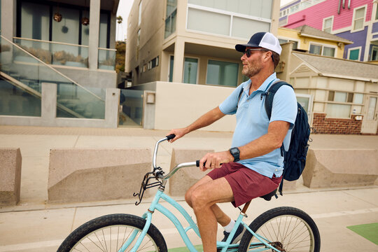 Man riding a bicycle in Venice Beach.