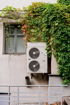 Air conditioning on the facade of a city building.
