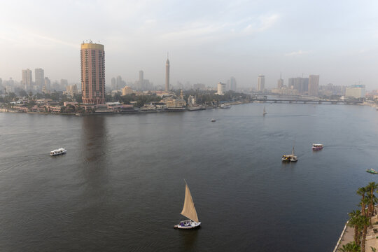 View of Boats on the Nile River in Cairo at Dawn With City Skyline