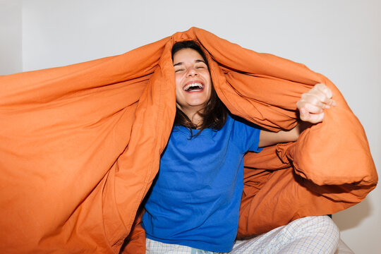 Joyful Moments Under a Blanket