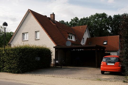 Exterior or White House with red roof in germany