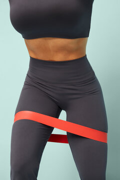 Young woman exercising with a resistance band for fitness