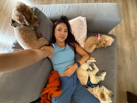 ugc wide angle selfie dogs on couch 