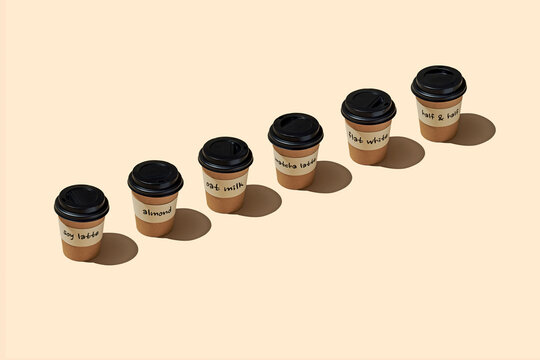 six different takeaway coffee cups in a diagonal line
