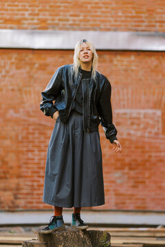 Model Poses in Urban Setting During Daytime in Modern Fashion Scene