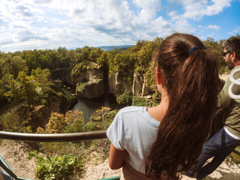 Girl and father enjoying landscape view during a hike in the mountains