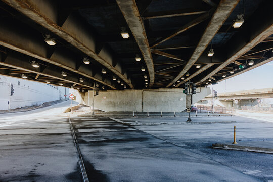 Underpass Roadway Beneath Steel Bridge in Urban City