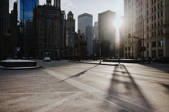 Sunlight Over Downtown Chicago Street and Historic Skyscrapers