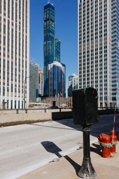 Tall Blue Glass Skyscraper Between Downtown Chicago Buildings