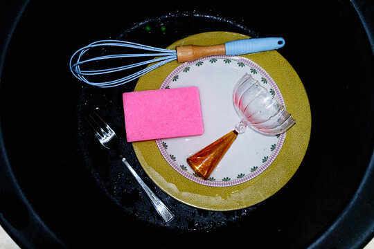 Kitchen items in a dishwashing sink 