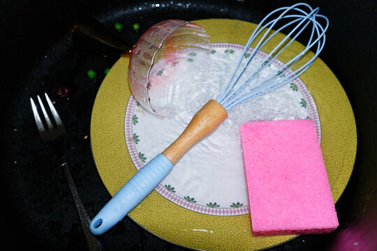 Kitchen items in a dishwashing sink 