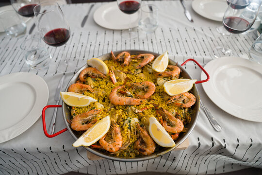 Large Dish Of Paella On The Dining Table