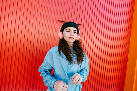 Confident young urban woman looking at camera portrait