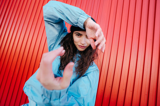 Confident young urban woman looking at camera portrait