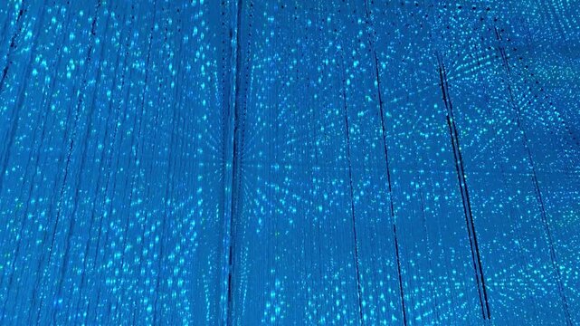 Blue tunnel light reflection abstract background pattern texture hypnotic glowing geometric shape creating peaceful meditative mood surreal visual effect modern digital art surface calm emotion LED