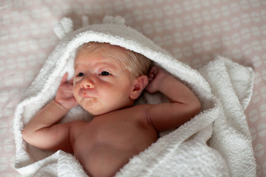 Newborn Baby Wrapped in Soft Hooded Towel