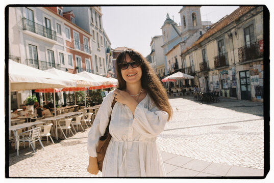 Smiling woman in Almada old town square