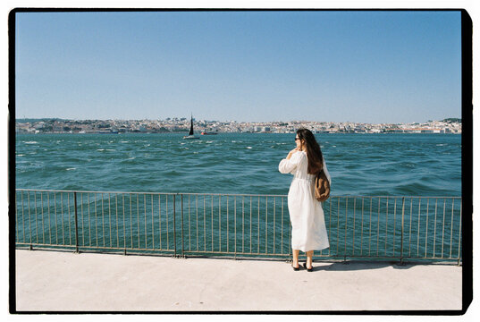Woman overlooking Lisbon waterfront
