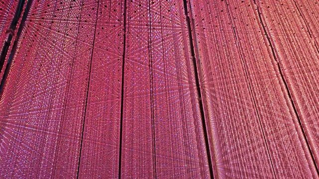 Vibrant magenta wooden plank background vertical grain texture peaceful organic rustic interior design featuring abstract pink purple textile waves elegant silk cloth red board construction wall