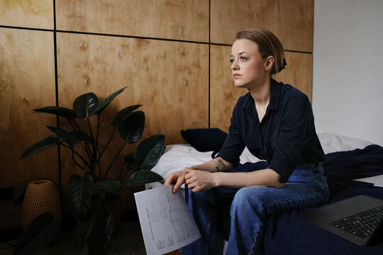 Person thinking about utility bills and home budget