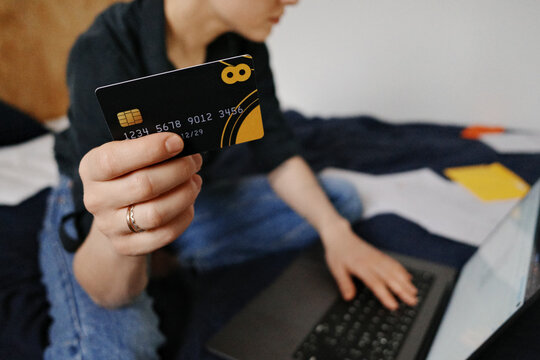 Person holding credit card for online payment and billing