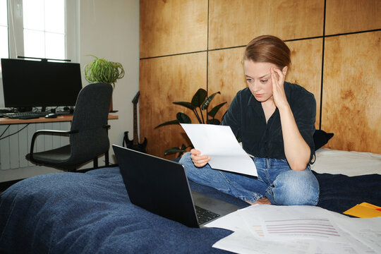 Person feeling stressed managing finances paying bills