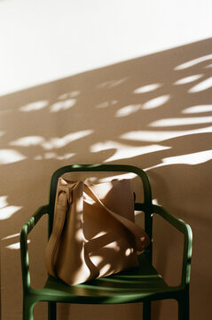 Light and shadows play on a chair