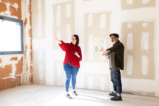 Interior designers team discussing options for space renovation 