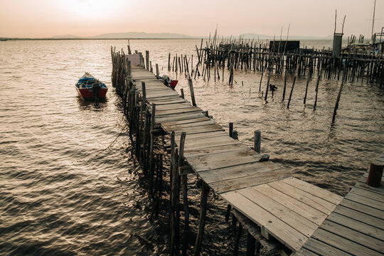 Wooden Jetty and Fishing Boat at Golden Hour