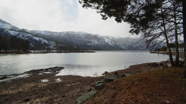 Nisser Lake Treungen Norway, Snowy Mountain Shoreline and Nordic Winter Landscape