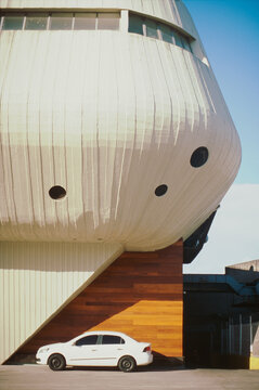 Futuristic Building Over Car