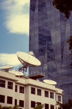 Satellite Dishes and Glass Tower