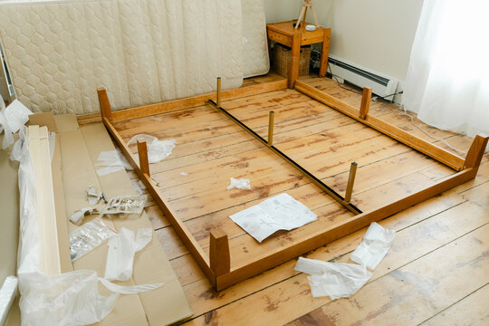 wooden bed being made 