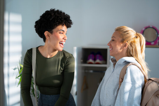 Laughing after workout at gym entrance