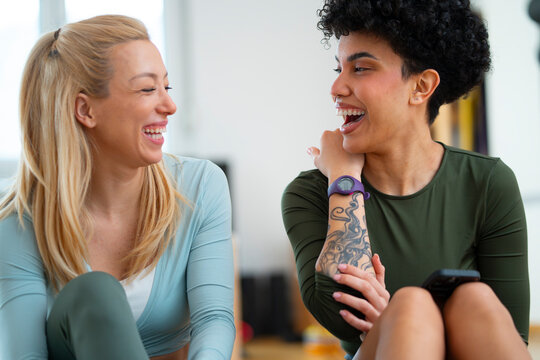 Laughing together during workout break