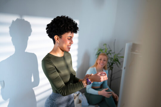Friends share moments in a bright room