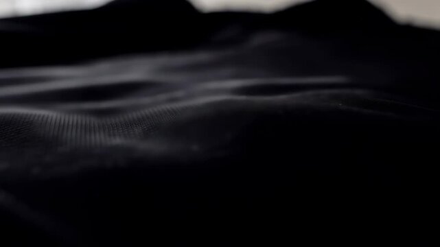 Abstract Dark Background With Subtle Light Patterns Creating a Sense of Depth and Texture.